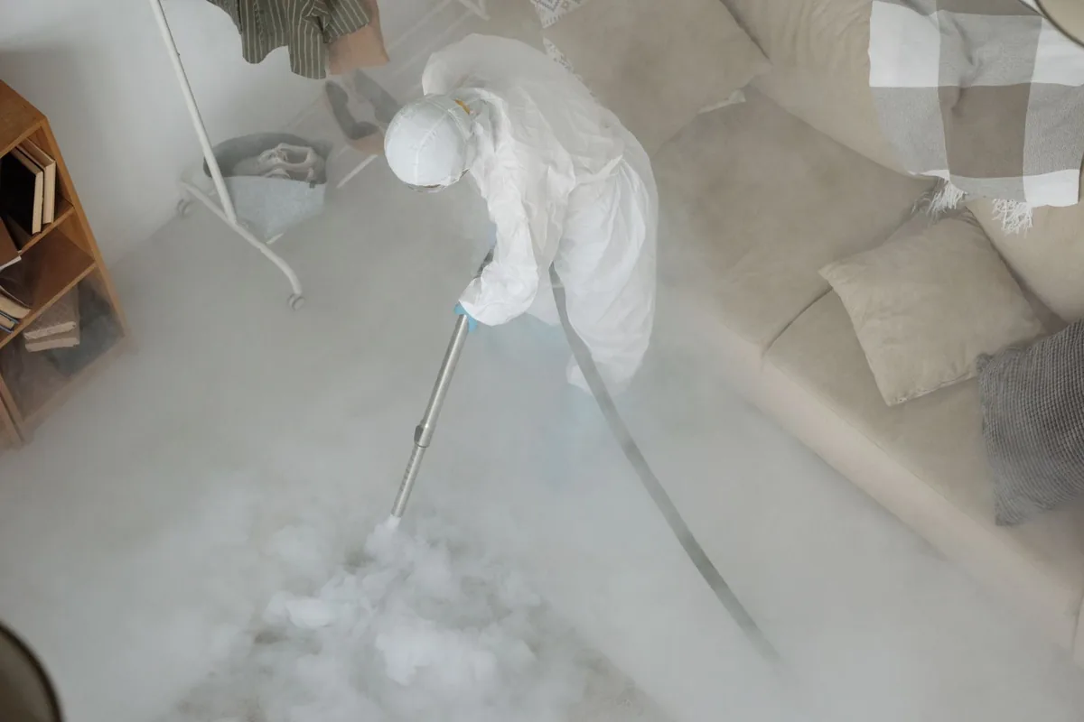 Biohazard cleanup technician in protective equipment, Southside, Louisville, KY
